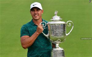 American professional golfer, Brooks Koepka with PGA trophy